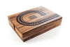 Wooden cribbage board with intricate design on a white background