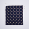 Flat lay of reusable Fair Isle cotton canvas gift bag as a zero-waste gift wrapping alternative