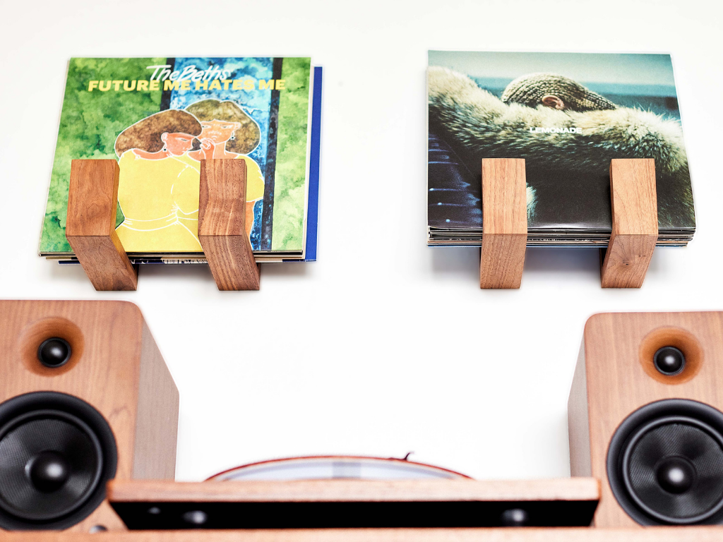Deep Cut Flip Record Display Shelf brackets in walnut and hard maple on a white background