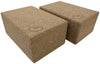Set of two natural cork yoga blocks in 3-inch and 4-inch sizes on a white background