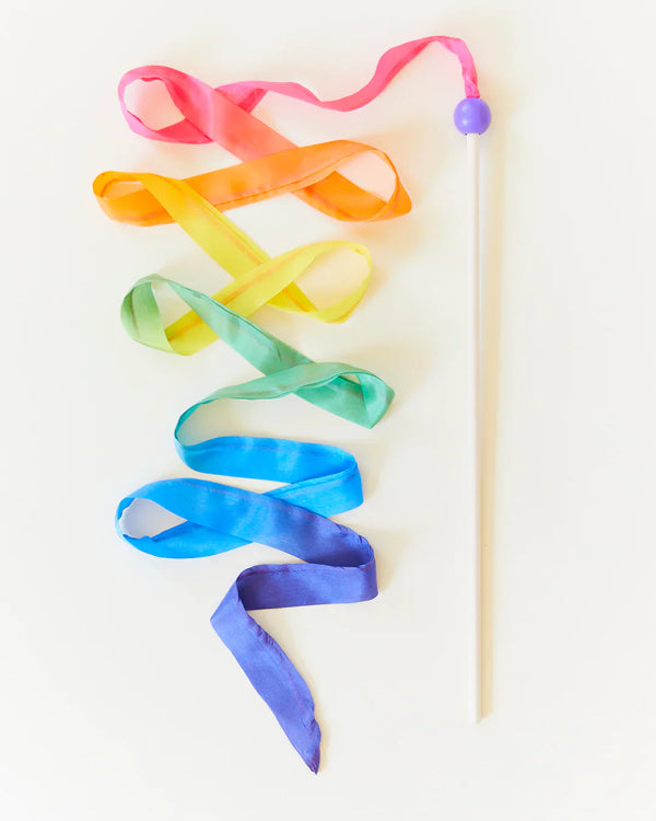 Colorful ribbon on a stick against a white background