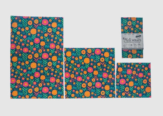 Set of colorful floral-patterned Meli Wraps on a light gray background