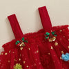 Red dress with festive decorations on a textured beige background