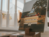 Canvas print of a vintage Ford truck with a person in the back, placed on a wooden stand.