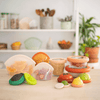 Food Huggers flexible fit stacking bowl lids stretched over bowls to replace cling film