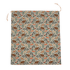 Reusable 22 inch cotton canvas gift bag by Hannah Pearlman, shown styled as a wrapped present