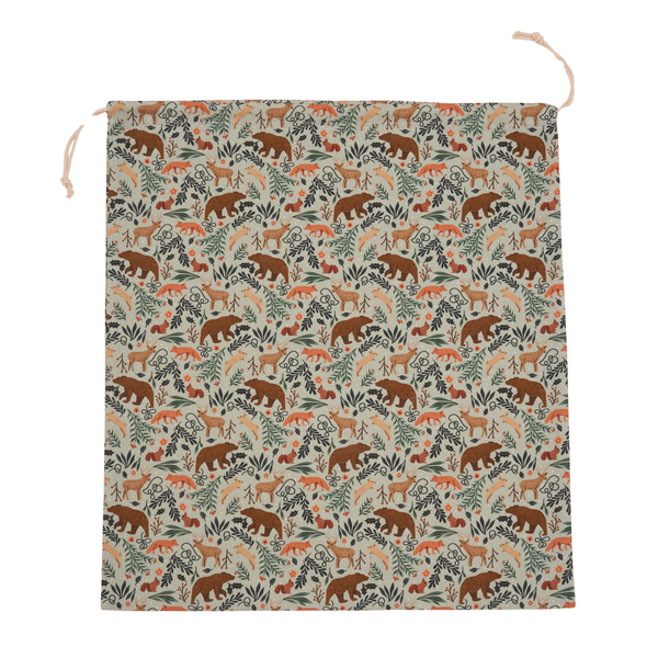 Reusable 22 inch cotton canvas gift bag by Hannah Pearlman, shown styled as a wrapped present