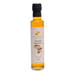 100% pure toasted sesame oil bottle, cold-pressed and ethically sourced from women farmers in rural Ghana