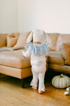 Child wearing the Circus Bunny Pajama Costume with floppy bunny ears