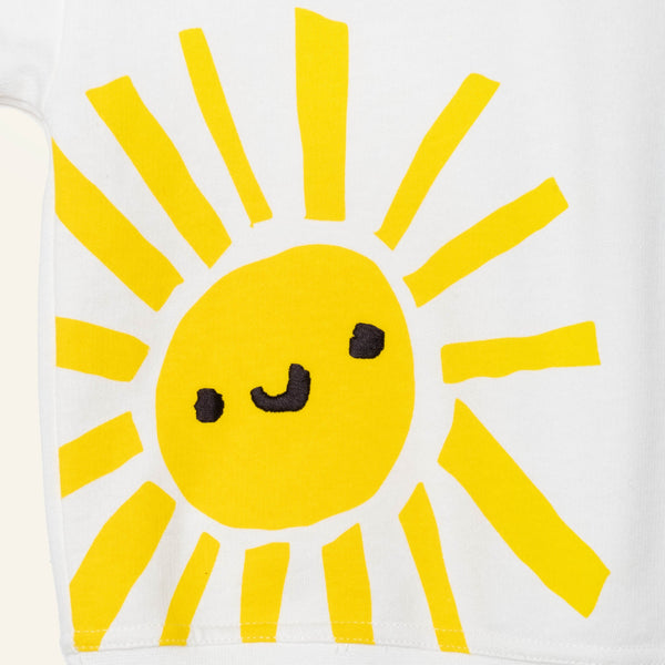 Yellow sun with a face on a white background