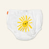 White diaper with a yellow sun design on a light beige background