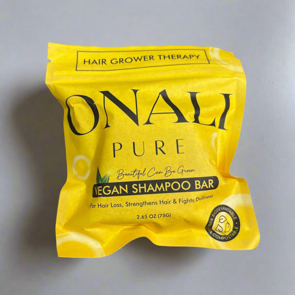 Yellow package of ONAY Pure Vegan Shampoo Bar on a gray surface