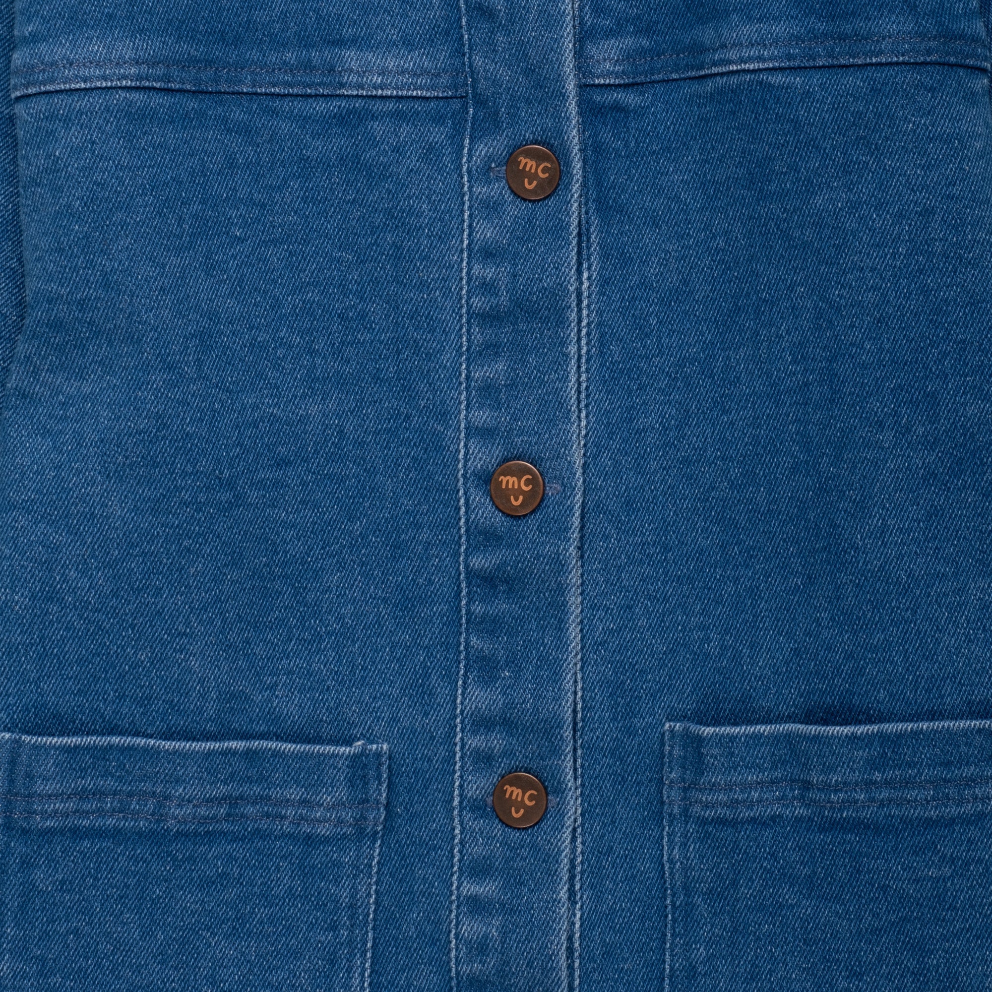 Front detail of the Mon Coeur Kids Denim Barn Jacket showing soft denim fabric and patch pockets