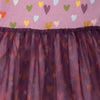 Close-up of the Mini Hearts Tulle Dress by Mon Coeur showing the heart print and tulle skirt layers