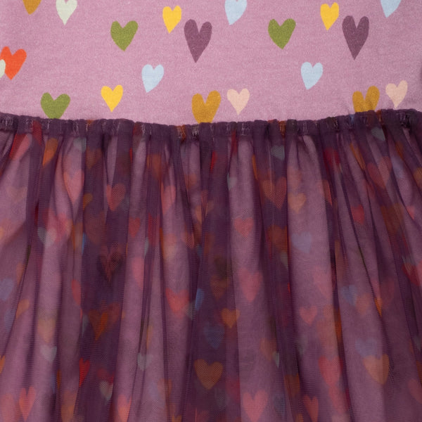 Close-up of the Mini Hearts Tulle Dress by Mon Coeur showing the heart print and tulle skirt layers