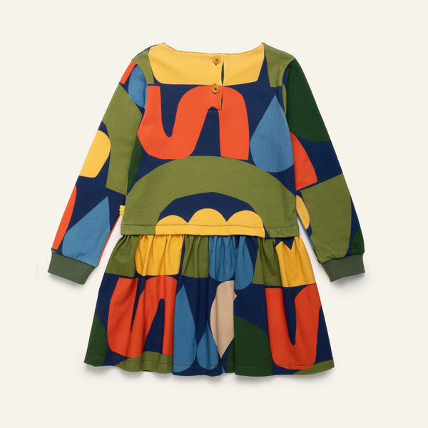 Colorful children's dress with abstract patterns on a white background