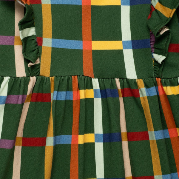 Close-up of Mon Coeur Fall Grid Ruffle Dress showing plaid pattern and ruffle trim detail
