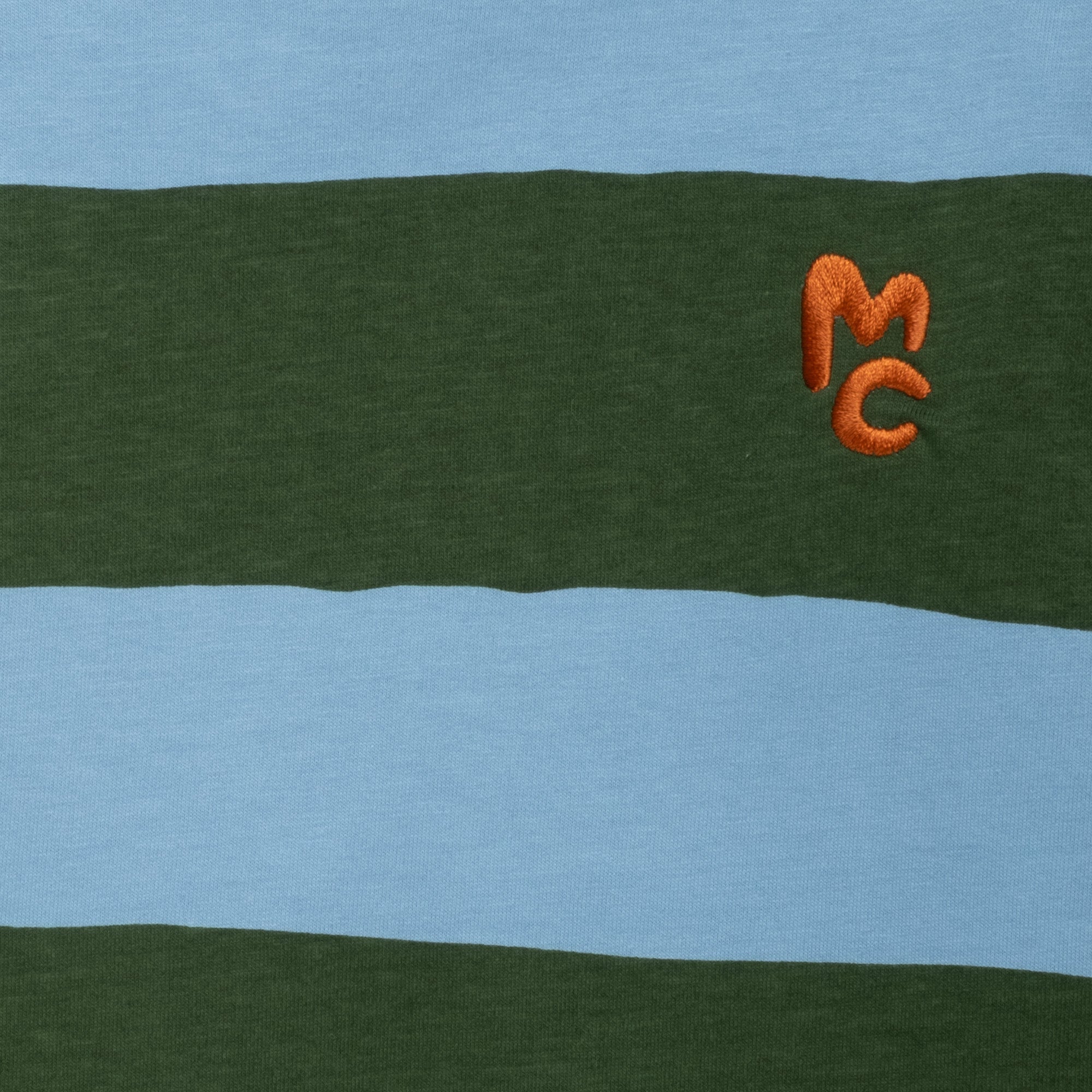 Close-up of Mon Coeur blue and green rugby stripe long sleeve t-shirt showing fabric detail and stripe pattern