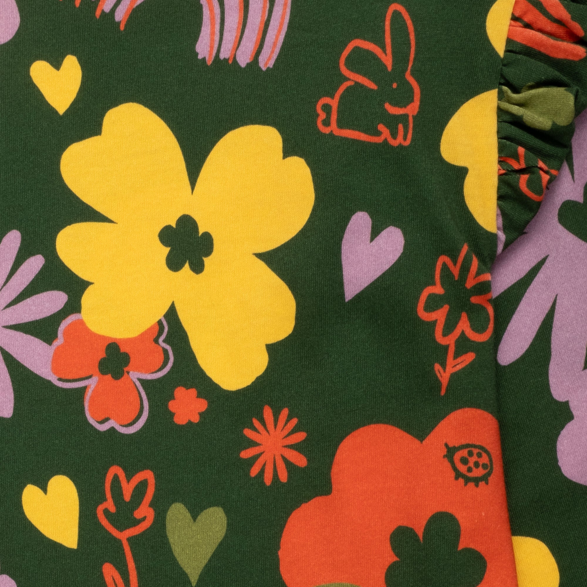 Close-up of ruffle shoulder detail on Mon Coeur Wildflower kids long sleeve T-shirt with floral print