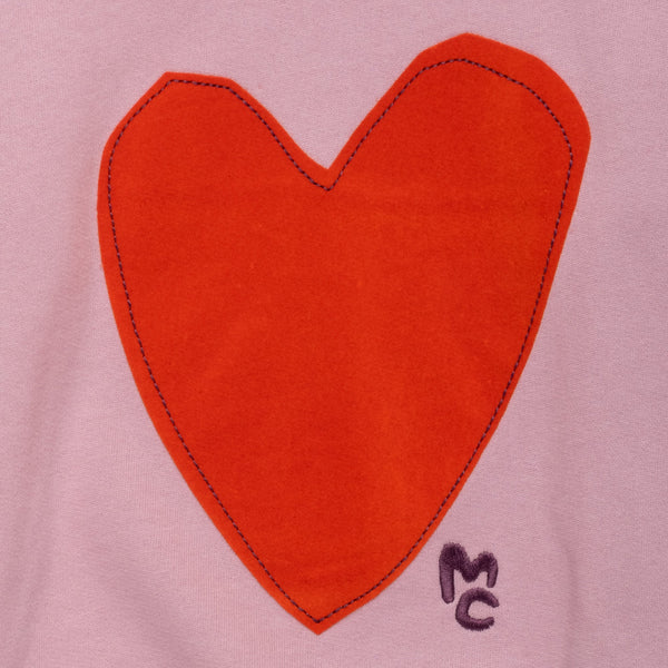 Close-up of the handcrafted-inspired felted heart appliqué on the Mon Coeur Kids Sweatshirt