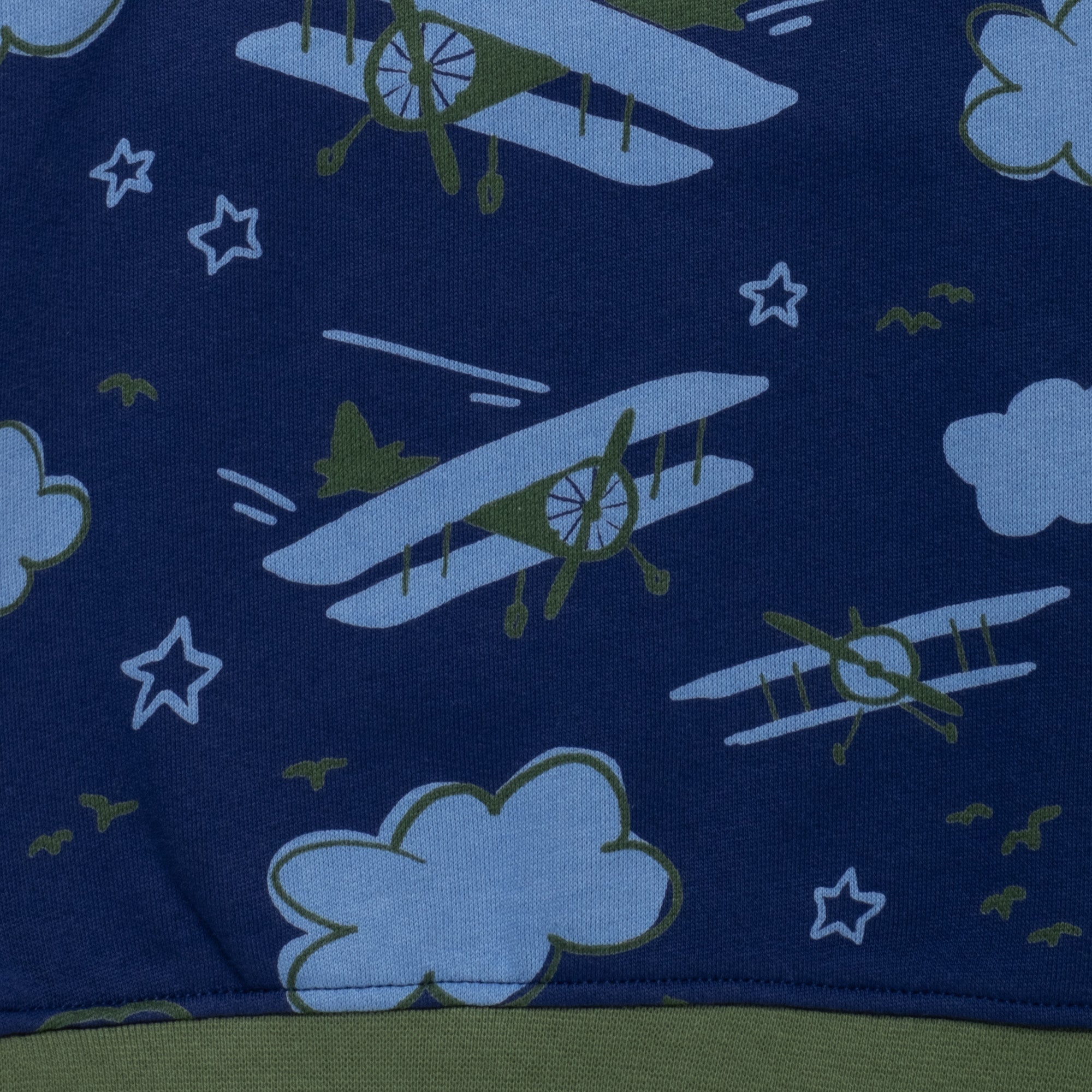 Front detail of Mon Coeur Kids Airplane Sweatshirt showing whimsical airplane and cloud print