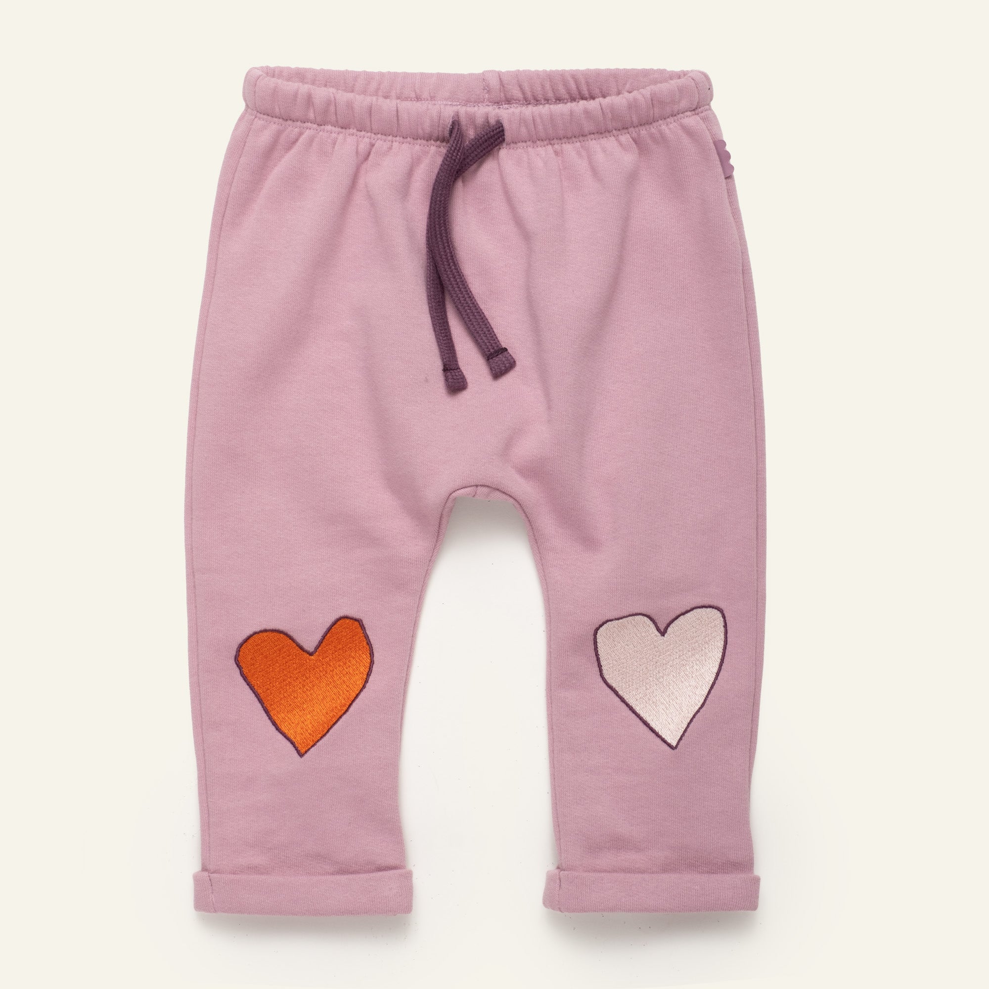 Mon Coeur Heartfelt Baby Jogger in organic and recycled cotton with embroidered heart detail at the knees, sizes 1Y–3Y