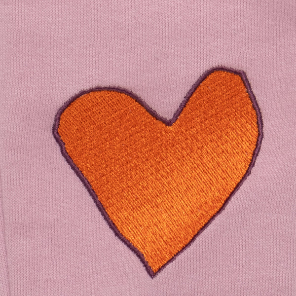 Close-up of embroidered heart knee detail on Mon Coeur Heartfelt Baby Jogger made in Portugal