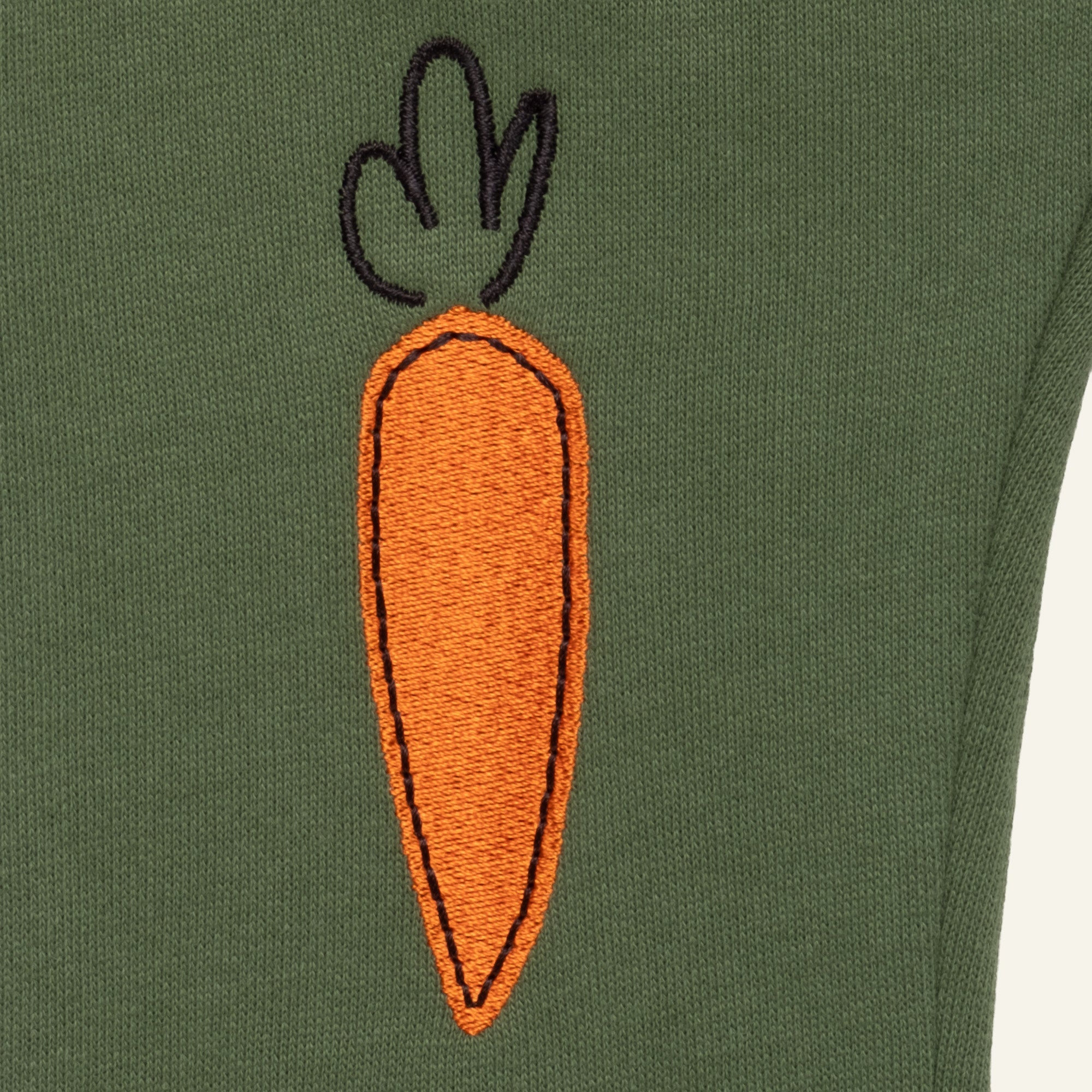 Close-up of Mon Coeur Embroidered Carrot Jogger showing knee embroidery and organic cotton fabric
