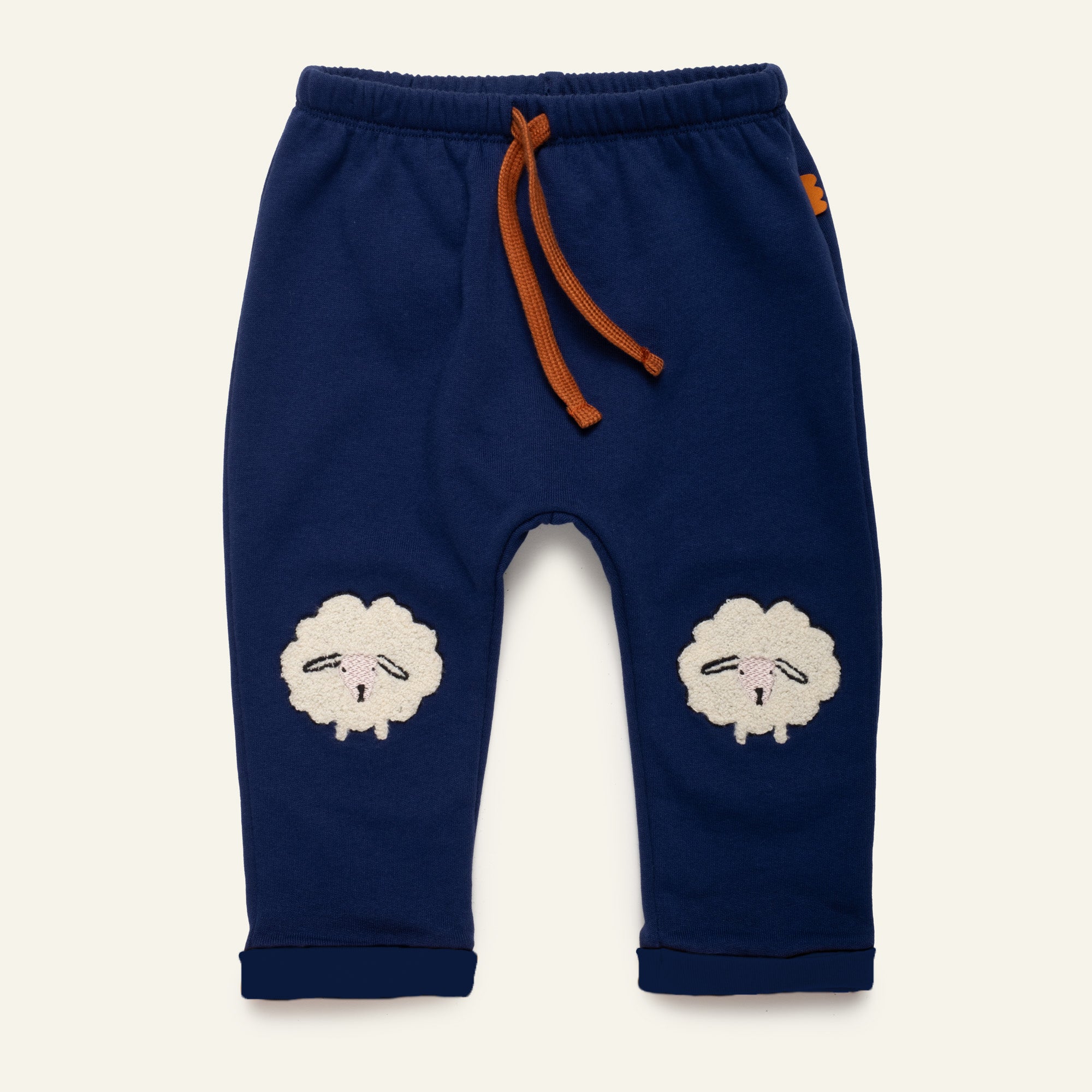 Mon Coeur Embroidered Cozy Sheep Jogger for toddlers, featuring boucle sheep appliqués at the knees, made from organic and recycled cotton
