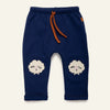 Mon Coeur Embroidered Cozy Sheep Jogger for toddlers, featuring boucle sheep appliqués at the knees, made from organic and recycled cotton