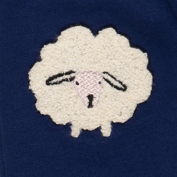 Close-up of the boucle sheep knee appliqué detail on the Mon Coeur Cozy Sheep Jogger