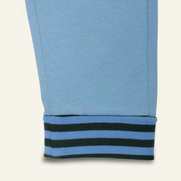 Mon Coeur Blue Jogger detail view showing contrast back pocket and green striped cuffs