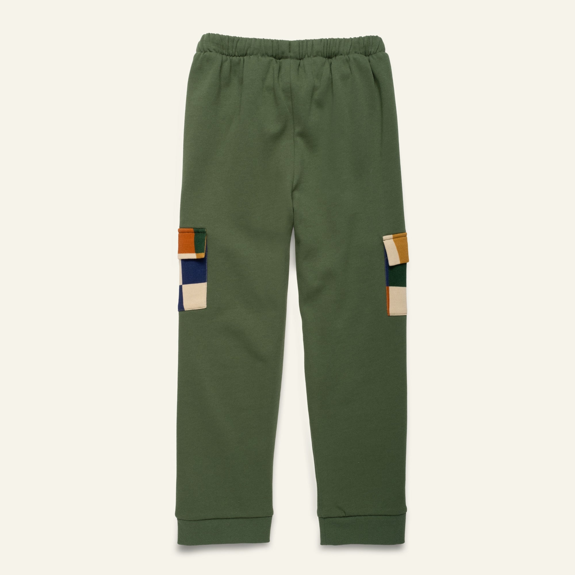 Green pants with colorful patchwork on a white background