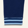 Close-up of a blue sweatshirt with light blue stripes on a white background