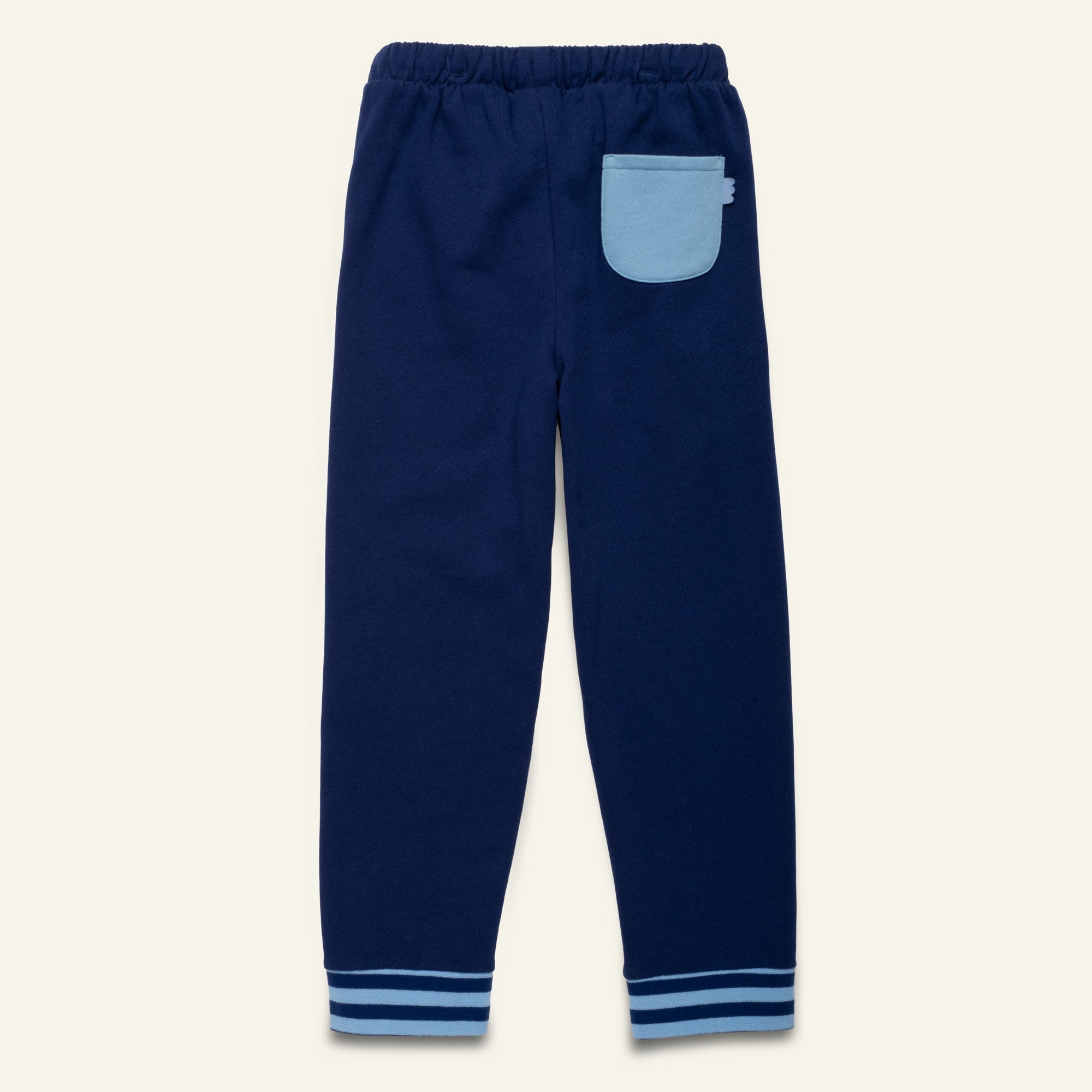 Close-up of the Mon Coeur Navy Jogger showing sporty striped cuffs and contrast back pocket detail