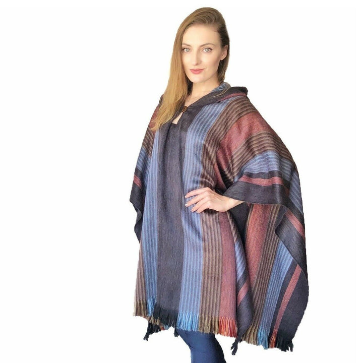Woman wearing a Six Band Alpaca Poncho showing the thin and thick colour band detail