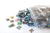 Resealable bag of pieces for the 59 Rue de Rivoli 1000-piece puzzle