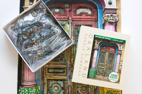 Open box of the 59 Rue de Rivoli jigsaw puzzle from Oakland Puzzle Company