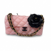 The Rose Classic Couture scented candle by Onali Pure lit and glowing warmly