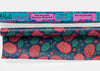 Close-up of Meli Wraps Dragonfruit beeswax wrap bulk roll with vibrant pink and green print detail