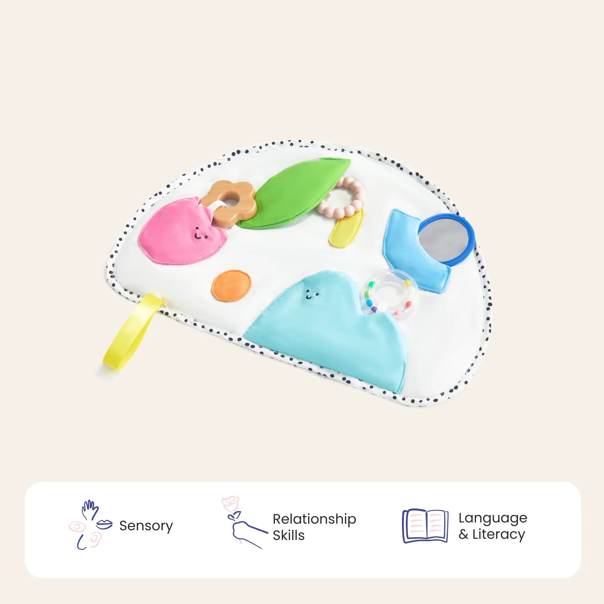 Colorful baby toy with various shapes and textures on a beige background