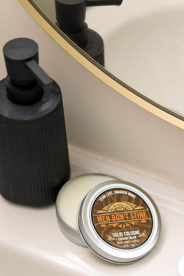 "Men Don’t Stink" Solid Cologne - 2.5 oz of travel-friendly, warm amber & spice scent. Long-lasting, mess-free, and crafted with premium natural ingredients. Buy now!