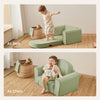Children playing on a green multi-functional chair/bed in a room with a basket and toys.