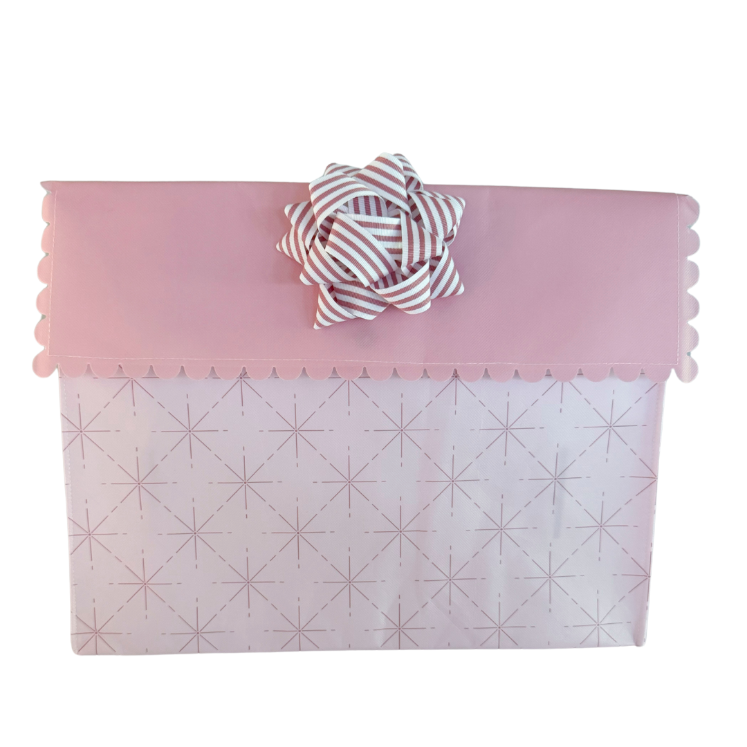 Pink EverBow 5 inch grosgrain bow attached to EverWrap gift bag