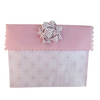 Pink EverBow 5 inch grosgrain bow attached to EverWrap gift bag