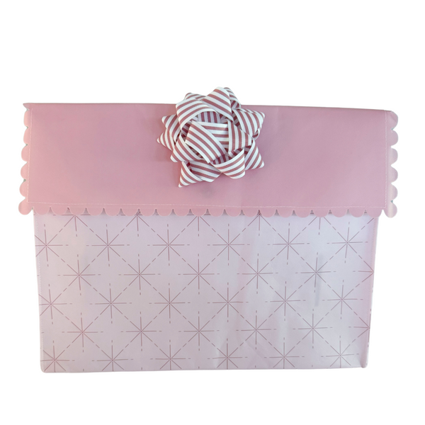 Pink EverBow 5 inch grosgrain bow attached to EverWrap gift bag