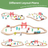 Wooden railway set with various layout plans on a white background