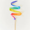 Colorful ribbon on a stick against a white background