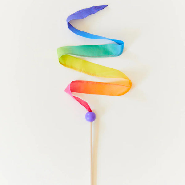 Colorful ribbon on a stick against a white background
