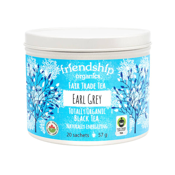 Tea canister with blue label featuring 'friendship organics' branding on a white background